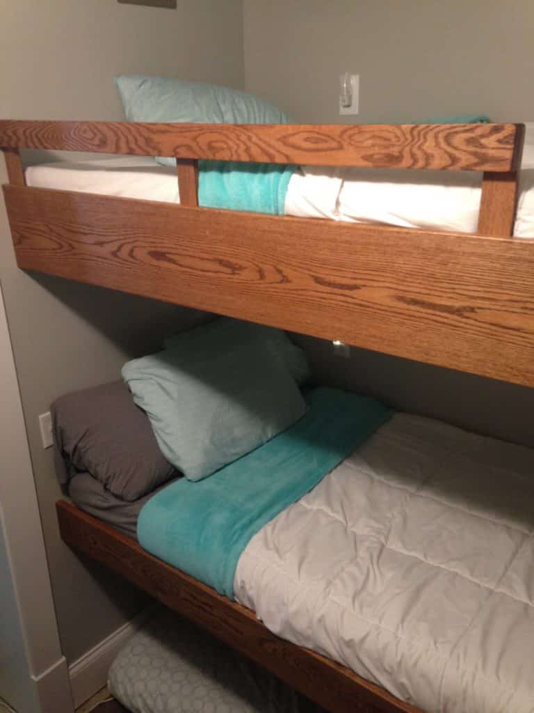 The idea of a tiny corner of space; a bunk room devoted purely to extra beds seemed genius to me.  There are no beds to be deflated, or rolled up. Easy