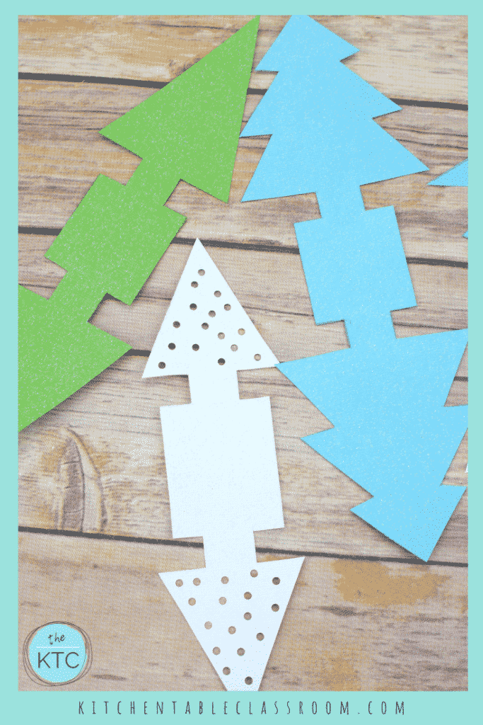 These paper Christmas tree ornaments come together quickly with just card stock!  This easy Christmas craft for kid is perfect on the mantle or holiday table