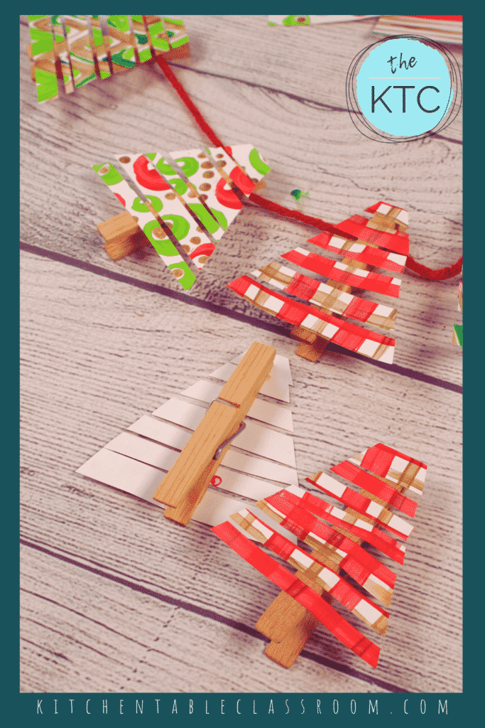 Paper Christmas trees become a Christmas garland thanks to simple wooden clothespins.