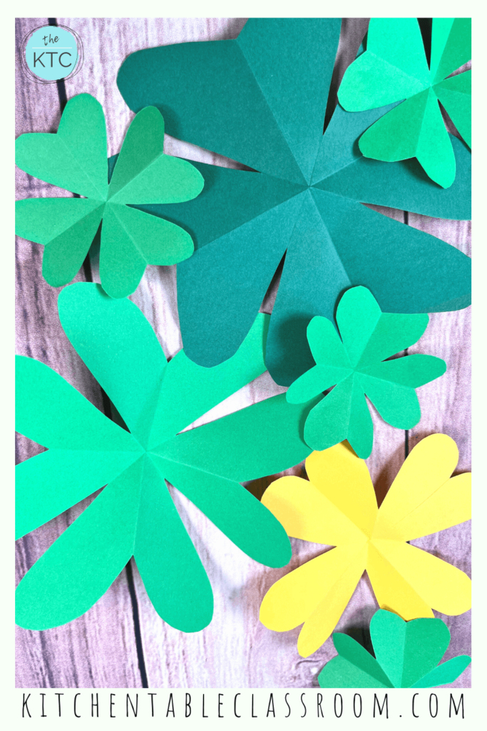 Cut a shamrock shape our of paper with a few easy folds and cuts.