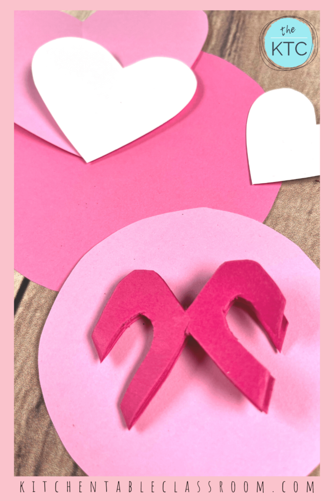 Make a cut paper heart wreath with a few simple folds and cuts.