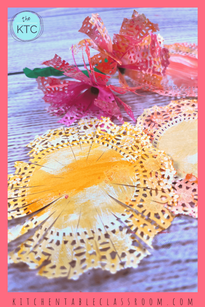 Grab a paper doily and paint away to get started on making paper doily flowers!